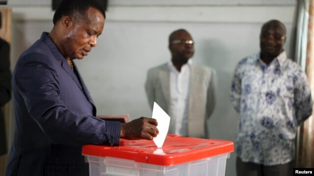 FILE - Republic of Congo President Denis Sassou Nguesso votes at a polling station in Brazzaville, Congo, Oct. 25, 2015. 