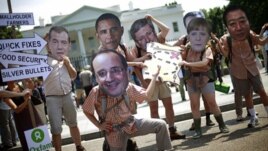 Demonstrators outside White House before G8 summit in Washington, May 17, 2012