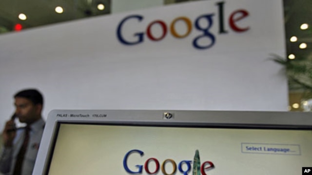 A security guard answers the phone at the reception counter of a Google office. (File Photo)