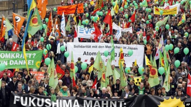 Anti-nuclear demonstrators march in Cologne, western Germany, March 26, 2011, to protest against nuclear power