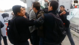 Turkish men are seen placing a plastic bag over the head of a U.S. sailor in Istanbul, Turkey, in a YouTube video, Nov. 12, 2014.