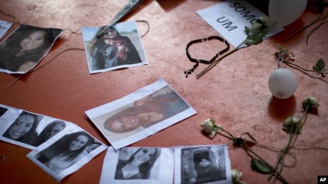 A makeshift memorial that include pictures of the victims of the Kiss nightclub fatal fire is seen inside the gymnasium where a collective funeral was held a day earlier, in Santa Maria, Brazil, January 29, 2013.