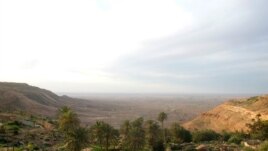 Overlooking a valley in the Nafusa Mountain area, Libya, April 9, 2012. At the far left, white streaks running down the mountain signal oil pipelines buried below. (Stephanie Figgins)