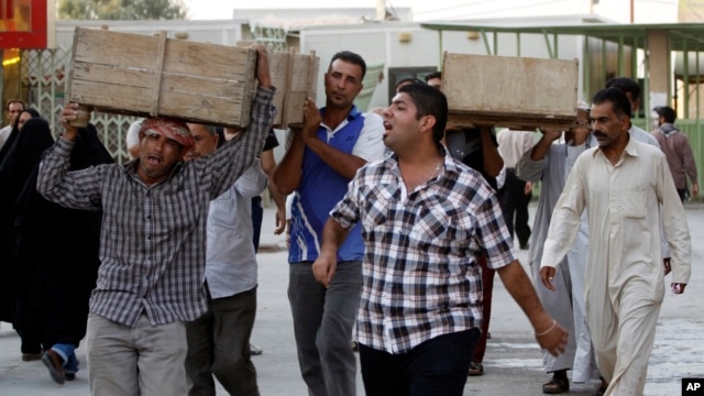 Bombing victims are taken for burial in the Sh'iite holy city of Najaf, Sept. 15, 2013.