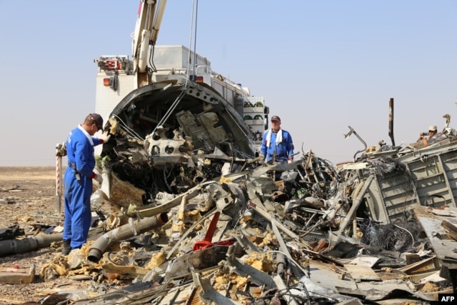 Russian emergency services personnel working at the crash site of a A321 Russian airliner in Wadi al-Zolomat, a mountainous area of Egypt's Sinai Peninsula. (Russian Emergency Ministry Handout photo)