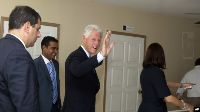 Former U.S. President and special U.N. envoy to Haiti Bill Clinton visits the Haiti Hotel School in Port-au-Prince, Monday, Sept. 17,  2012. On the same day, Clinton made a joint announcement with Qatar's ambassador that the Middle Eastern nation will give $20 million to Haiti.