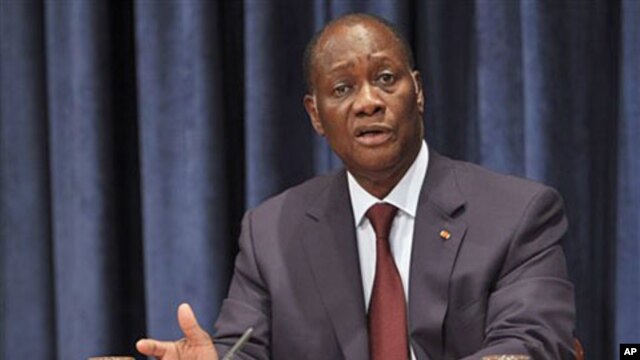 Ivory Coast President Alassane Ouattara speaks to reporters during a news conference at the United Nations headquarters in New York, July 27, 2011