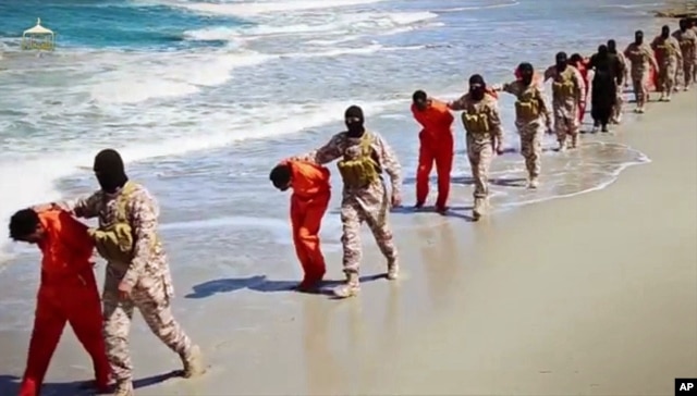 This undated image made from video released by Islamic State militants April 19, 2015, purports to show a group of captured Ethiopian Christians taken to a beach before being executed.