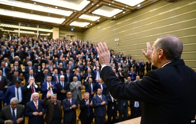Turkish President Recep Tayyip Erdogan addresses the heads of villages at his palace in Ankara, Turkey, Monday, Oct. 26, 2015.
