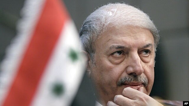 Yussef Ahmed, Syria's ambassador to the Arab League, looks on during the body's emergency session on Syria at the Arab League headquarters in Cairo, Egypt, November 12, 2011.