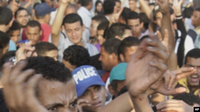 Egyptian protesters shout slogans against the military rulers during their protest at Tahrir Square, the focal point of the recent Egyptian uprising, in Cairo, Egypt, Sunday, July 24, 2011.