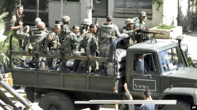Syrian troops, in this citizen journalism image, August 14, 2011