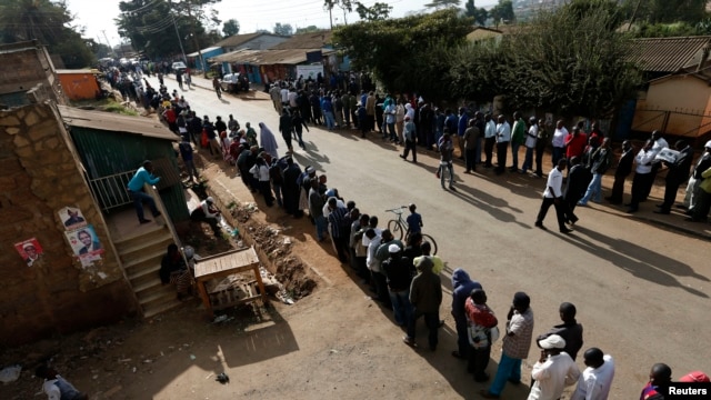 Kenyans wait to cast their vote at a polling station in Kibera.