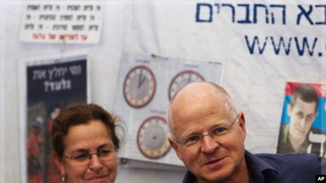 The parents of captured Israeli soldier Gilad Shalit are seen at a protest tent outside the residence of Israel's PM Netanyahu in Jerusalem
12/10/2011