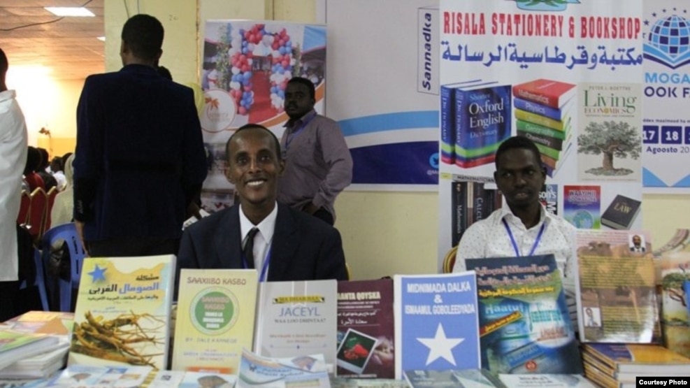 Participants are seen behind a display at the Mogadishu Book Fair in Mogadishu, Somalia. (Courtesy - Mogadishu Book Fair)