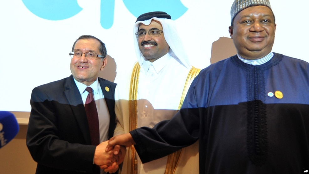 FILE -- Algerian Energy Minister Noureddine Boutarfa, left, Bin Saleh Al-Sada, Minister of Energy and Industry of Qatar, center, and acting Secretary General of OPEC Mohammed Barkindo, right, shake hands at the end of a meeting of oil ministers of the Organization of Petroleum Exporting Countries in Algiers, Algeria, September 28, 2016.