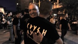 Extreme far-right Golden Dawn party's supporters celebrate and has vowed to kick out immigrants and mine Greece's borders with Turkey