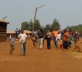 Refugees walk down the main street in the Gasorwe Refugee Camp in northern Burundi.