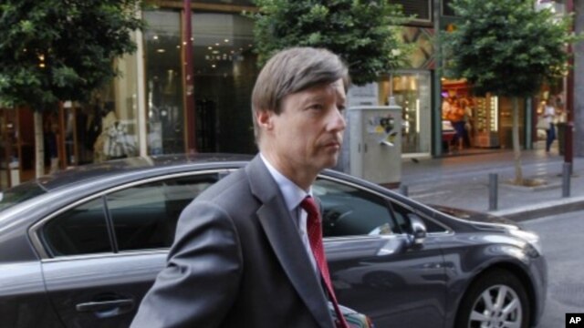 European Commission official Matthias Mors arrives at the Greek Development Ministry in Athens, August 30, 2011