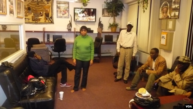 Inside the Malian Association of New York, expats meet regularly to gather news of their conflict-ridden homeland and to share emotional support. (A. Phillips/VOA)