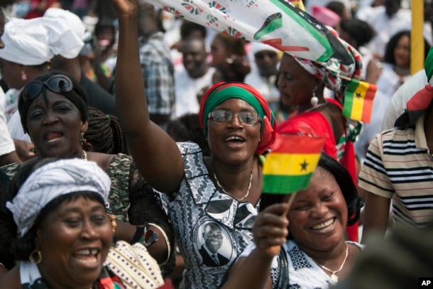 FILE - Supporters cheer during the inauguration ceremony for President John Mahama in Accra, Ghana, Jan. 7, 2013. The election for Ghana's next president will be held December 7.
