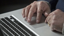A U.S. cyber warfare expert works on his laptop computer, December 1, 2011.