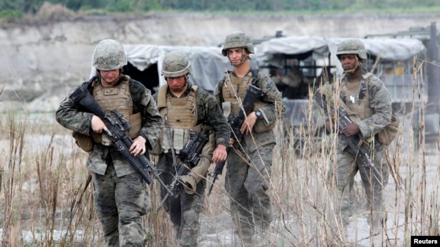 FILE - U.S. troops are seen on patrol during joint U.S.-Philippines military exercises in Tarlac province, north of Manila.