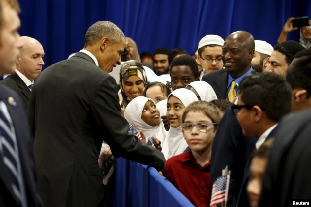 President Barack Obama greets students after his remarks at the Islamic Society of Baltimore mosque in Catonsville, Maryland, Feb. 3, 2016.