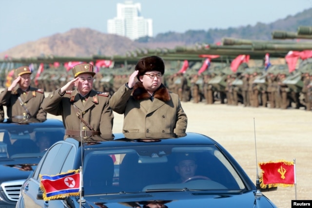 FILE - North Korean leader Kim Jong Un salutes as he arrives to inspect a military drill at an unknown location, in this undated photo released by North Korea's Korean Central News Agency, March 25, 2016.