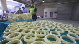 Customs officials in Hong Kong with illegal ivory products they intercepted in November last year. Some wildlife experts warn that a legal trade in ivory has previously resulted in an increase in the poaching of elephants for their tusks.