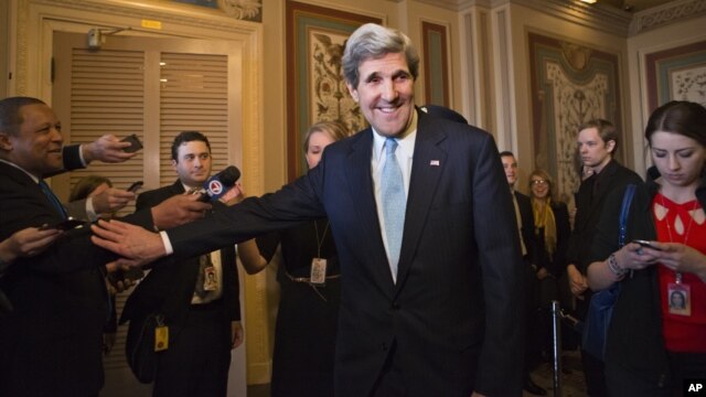 Sen. John Kerry, D-Mass., emerges after a unanimous vote by the Senate Foreign Relations Committee approving him to become America's next top diplomat, replacing Secretary of State Hillary Rodham Clinton, on Capitol Hill in Washington, January 29, 2013.