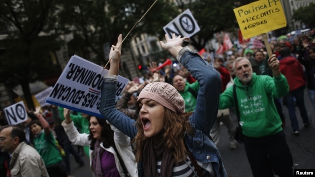 Protesters shout slogans during a demonstration against cuts in public education, in central Madrid, September 27, 2012.