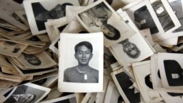 A pile of mugshots provided to the Documentation Center of Cambodia by an anonymous collector. (Credit: DC-Cam)