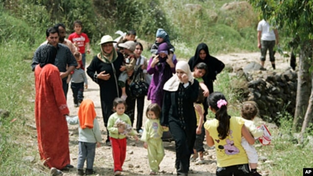 Syrian women and children arrive in Wadi Khaled in northern Lebanon, near the Lebanese-Syrian border May 16, 2011