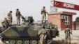 FILE -Turkish military station at the border gate with Syria, across from Syrian rebel-controlled Tel Abyad town, in Akcakale, Turkey, October 7, 2012.