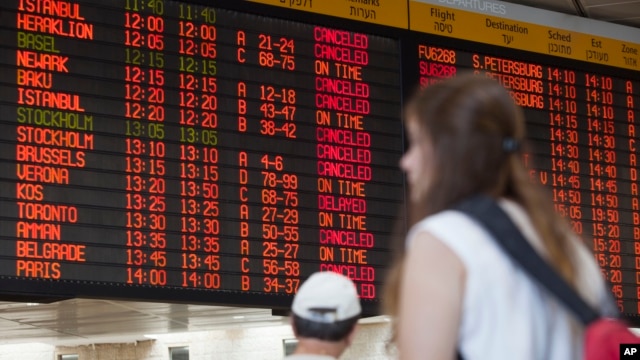 A departure flight board displays various canceled and delayed flights in Ben Gurion International airport a day after the U.S. Federal Aviation Administration imposed a 24-hour restriction on flights to the airport in Tel Aviv, Israel, July 23, 2014.  