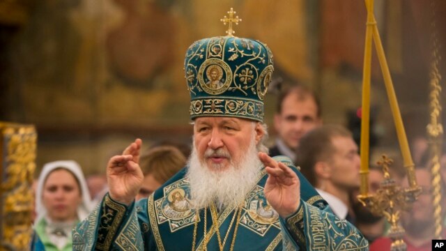 FILE - Russia's Patriarch Kirill officiates at a religious service inside the Cathedral of the Assumption at Cathedral Square in Moscow, Russia, Nov. 4, 2015.