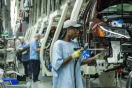 Factory work is often scheduled in shifts. In this June 2013 photo, workers assemble Volkswagen cars at the German automaker's factory in the U.S. state of Tennessee. (FILE PHOTO)