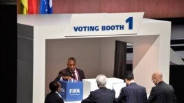An official casts his ballot in the vote to decide on the FIFA presidency in Zurich, Switzerland, May 29, 2015.