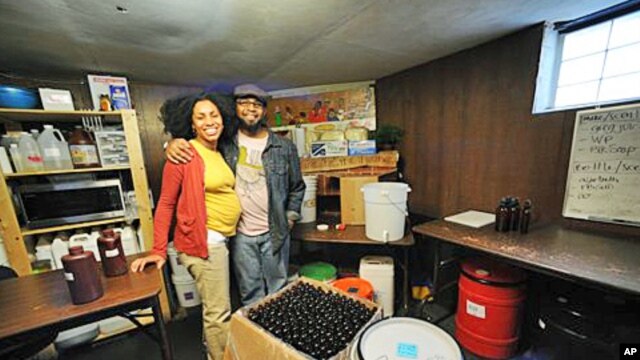 Pierre and Jamyla Bennu pose in their basement production facility in their home in Baltimore (File)