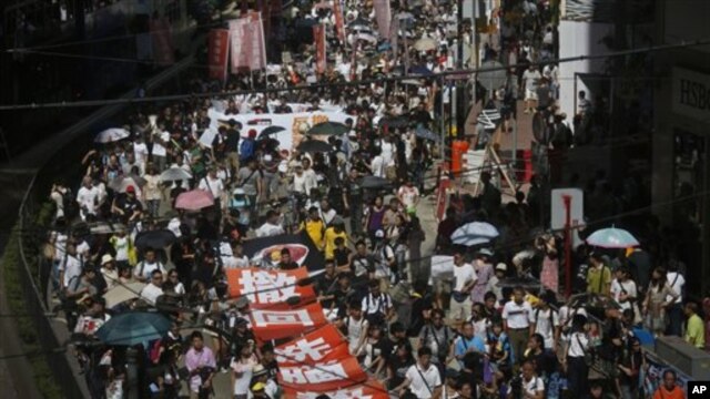 Thousands of people marched in Hong Kong to protest a plan to hold Chinese patriotism classes in schools