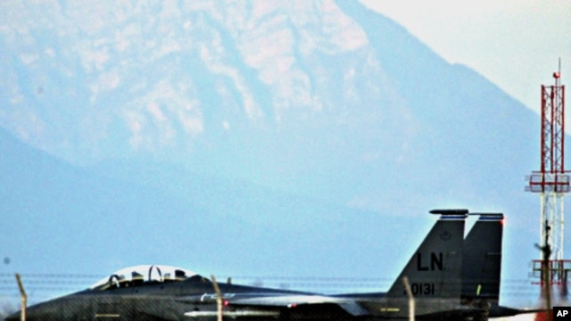 A U.S. Air Force F-15E Strike Eagle fighter jet taxis before taking off from the NATO airbase in Aviano, March 21, 2011