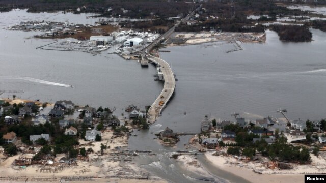 The view of storm damage over the Atlantic Coast in Seaside Heights, N.J.,  Wednesday, Oct. 31, 2012, from a helicopter traveling behind the helicopter carrying President Obama and New Jersey Gov. Chris Christie.