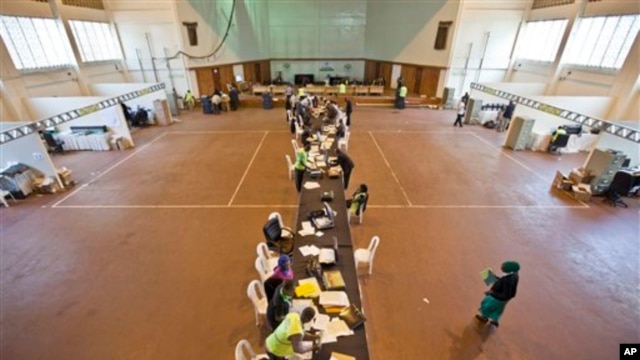 Electoral workers engage in vote tally verification process at National Tallying Center in Nairobi, Kenya March 6, 2013