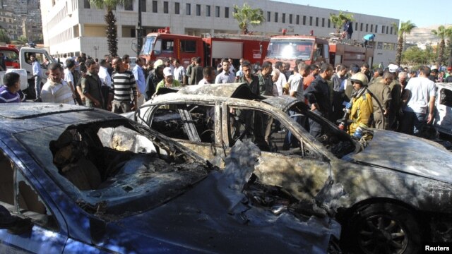 A view shows the wreckage after a car bomb exploded in the Syrian capital Damascus September 7, 2012