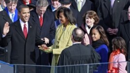 Barack Obama is sworn in by Chief Justice John Roberts as the 44th president of the United States