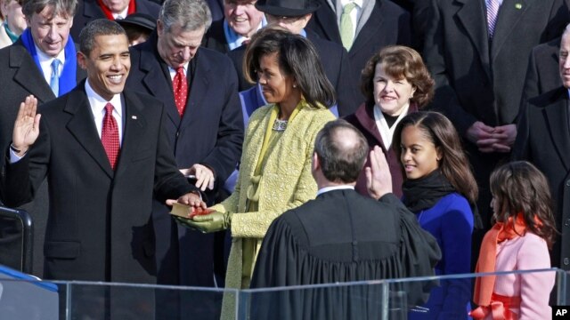 Barack Obama is sworn in by Chief Justice John Roberts as the 44th president of the United States