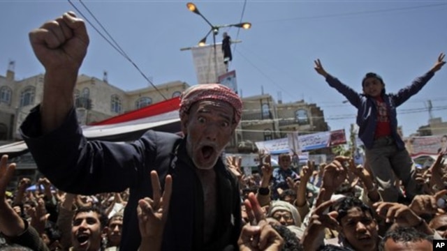 An anti-government protester reacts during a demonstration demanding the resignation of Yemeni President Ali Abdullah Saleh in Sana'a, Yemen, April 20, 2011