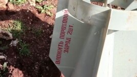 Screen capture from video shot by VOA shows remains of bomb with Russian markings that seems to bolster the activists' claims that Syrian government used cluster bombs, in Azaz, Syria. (VOA)