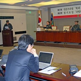 Former North Korean soldiers, who have joined a resistance group, briefing reporters